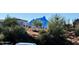 Beautiful street view of a home with desert landscaping and mountain views at 16657 E Gunsight Dr # 182, Fountain Hills, AZ 85268