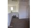 Hallway with carpeted floors, neutral-colored walls, and decorative pillows at 17622 W Missouri Ave, Litchfield Park, AZ 85340