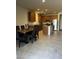 Spacious kitchen with stainless steel appliances, granite countertops, and an island with a dining area at 17622 W Missouri Ave, Litchfield Park, AZ 85340