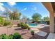 Picturesque backyard with a pool and rock landscaping and a privacy wall at 18813 N Summerbreeze Way, Surprise, AZ 85374