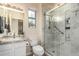 Bathroom showcases granite vanity, modern lighting, and glass enclosed shower at 18813 N Summerbreeze Way, Surprise, AZ 85374