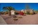 Attractive single-story home boasts desert landscaping, a healthy palm tree, and a well-maintained front yard with curb appeal at 18813 N Summerbreeze Way, Surprise, AZ 85374