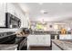 Kitchen showcases granite countertops, stainless steel appliances, and bright lighting at 18813 N Summerbreeze Way, Surprise, AZ 85374