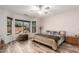 Bedroom with scenic outdoor views, stylish floors, and comfortable furnishings at 18813 N Summerbreeze Way, Surprise, AZ 85374