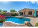 Inviting pool area featuring lush landscaping, desert foliage and a hammock at 18813 N Summerbreeze Way, Surprise, AZ 85374