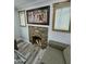 Close-up of a charming stone fireplace in a cozy living room setting, with natural light streaming through nearby windows at 1953 W Granada Rd, Phoenix, AZ 85009