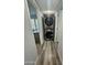 Modern laundry area with stacked washer and dryer units, and wood-look flooring at 1953 W Granada Rd, Phoenix, AZ 85009