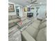 Inviting living room with neutral sofas and a view of the dining area and adjacent kitchen at 1953 W Granada Rd, Phoenix, AZ 85009