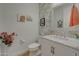Stylish powder bathroom with patterned wallpaper and marble vanity top at 20012 W Campbell Ave, Buckeye, AZ 85396