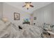 Well lit bedroom featuring stylish palm patterned bedding and decor at 20012 W Campbell Ave, Buckeye, AZ 85396