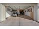 Spacious garage with epoxy flooring, a golf cart, and ample storage solutions at 20012 W Campbell Ave, Buckeye, AZ 85396