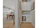 Hallway view of dining area and built-in cabinets with small dog house at 20012 W Campbell Ave, Buckeye, AZ 85396