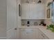 Bright kitchen features white cabinets, quartz counters, and stylish decor at 20012 W Campbell Ave, Buckeye, AZ 85396