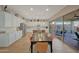 Open kitchen and dining area with a seamless transition to the outdoor living space through sliding glass doors at 20012 W Campbell Ave, Buckeye, AZ 85396