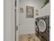 Modern laundry room with front-loading washer and dryer and stylish decor at 20012 W Campbell Ave, Buckeye, AZ 85396