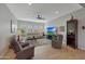Bright living room with large windows, comfortable seating, and stylish decor at 20012 W Campbell Ave, Buckeye, AZ 85396