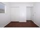 Neutral bedroom with built in wardrobe closet and laminate wood flooring at 2401 N 70Th St # G, Scottsdale, AZ 85257