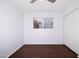 Bright, white bedroom with ceiling fan and closet at 2401 N 70Th St # G, Scottsdale, AZ 85257