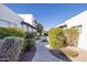 Exterior view of the community buildings with manicured landscaping and walking paths at 2401 N 70Th St # G, Scottsdale, AZ 85257