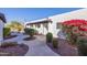 Landscaped walkway between buildings in a well-maintained community at 2401 N 70Th St # G, Scottsdale, AZ 85257
