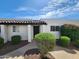 Charming home with a well-manicured front yard featuring lush greenery and a welcoming entryway at 2401 N 70Th St # G, Scottsdale, AZ 85257