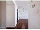Hallway leading to living room with modern hanging light fixture at 2401 N 70Th St # G, Scottsdale, AZ 85257