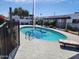 Sparkling community pool with clear blue water, surrounded by a secure fence and lounge seating at 2401 N 70Th St # G, Scottsdale, AZ 85257