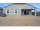 Spacious backyard featuring desert landscaping and a covered patio, perfect for outdoor entertaining at 25449 W Graham Trl, Buckeye, AZ 85326