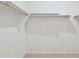 Spacious walk-in closet with ample shelving for optimal storage at 25449 W Graham Trl, Buckeye, AZ 85326