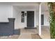 Covered front porch with security door and decorative brick accents at 2593 E Commonwealth Cir, Chandler, AZ 85225