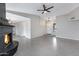 Open-concept living space with a cozy fireplace and modern tile flooring at 2593 E Commonwealth Cir, Chandler, AZ 85225