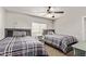 This bedroom has two twin beds, a ceiling fan, and plenty of natural light at 28422 N 32Nd Ln, Phoenix, AZ 85083