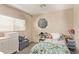 Cozy bedroom with plenty of natural light, complemented by charming decor and soft furnishings at 28422 N 32Nd Ln, Phoenix, AZ 85083