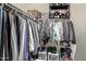 Walk-in closet offers ample storage space with shelves, hanging rods and organizational containers at 28422 N 32Nd Ln, Phoenix, AZ 85083