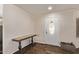 Bright foyer featuring a decorative front door, hardwood floors, and a stylish console table at 28422 N 32Nd Ln, Phoenix, AZ 85083