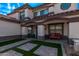Inviting front porch with comfortable seating and well-maintained landscaping, and a brick walkway at 28422 N 32Nd Ln, Phoenix, AZ 85083