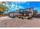 Charming two-story home with a tile roof, desert landscaping, and a well-manicured lawn at 28422 N 32Nd Ln, Phoenix, AZ 85083