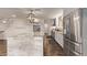 Spacious kitchen with a marble island, stainless steel appliances, and stylish pantry at 28422 N 32Nd Ln, Phoenix, AZ 85083