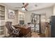 Office space with custom bookshelves, wood floors, and a workout machine at 28422 N 32Nd Ln, Phoenix, AZ 85083