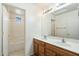 Bright bathroom features a double sink vanity and a separate shower and tub area at 3410 E Pageant Pl, Gilbert, AZ 85297