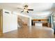 Open-concept living space flows into the kitchen, and features a staircase leading to the second floor at 3410 E Pageant Pl, Gilbert, AZ 85297