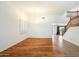 Open living space boasts wood floors, staircase, high ceiling, and bright natural light at 3410 E Pageant Pl, Gilbert, AZ 85297