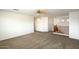 Upstairs loft area featuring neutral carpeting, wood railings, and natural lighting at 3410 E Pageant Pl, Gilbert, AZ 85297