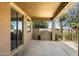 Covered patio features a built-in grill, ideal for outdoor entertaining and relaxation at 3410 E Pageant Pl, Gilbert, AZ 85297