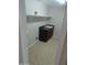Functional laundry room with storage cabinets and a built-in sink at 36452 W Velazquez Dr, Maricopa, AZ 85138