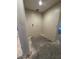 Empty walk-in closet ready for customization, awaiting flooring and shelving to maximize storage at 36452 W Velazquez Dr, Maricopa, AZ 85138