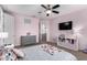 Serene bedroom featuring a ceiling fan and mounted television at 3687 E Blue Spruce Ln, Gilbert, AZ 85298
