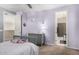 Cozy bedroom featuring a ceiling fan and bathroom access at 3687 E Blue Spruce Ln, Gilbert, AZ 85298