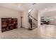 Inviting entryway featuring tile flooring, staircase, and views into the living room space at 3687 E Blue Spruce Ln, Gilbert, AZ 85298