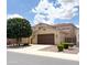 Two-story home with private driveway, 2-car garage, well maintained landscaping, and a tile roof at 3687 E Blue Spruce Ln, Gilbert, AZ 85298